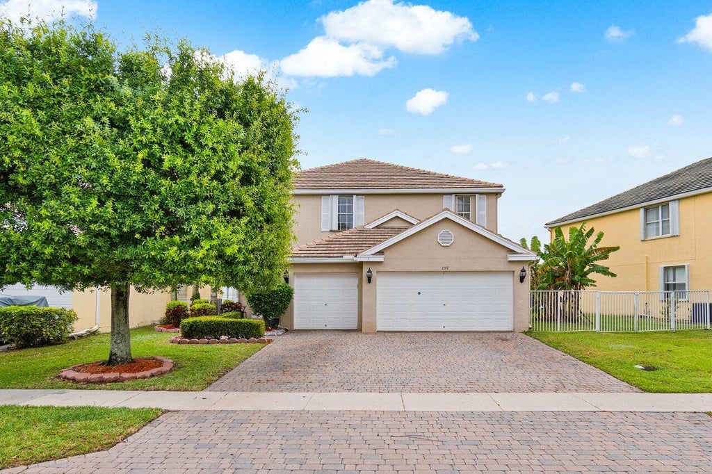 Photo of 259 Kensington Way, Royal Palm Beach, FL 33414 (MLS # R10975683)