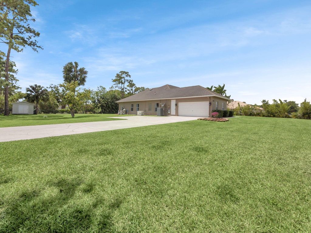 Photo of 8465 Mandarin Boulevard, Loxahatchee, FL 33470 (MLS # R11086276)