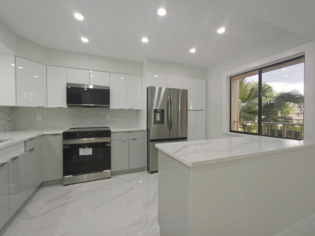 Photo of 7280 Amberly Lane #207, Delray Beach, FL 33446 (MLS # B26056805)