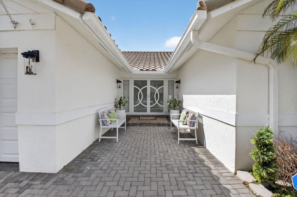 Photo of 2402 NW 30th Street, Boca Raton, FL 33431 (MLS # B26031666)