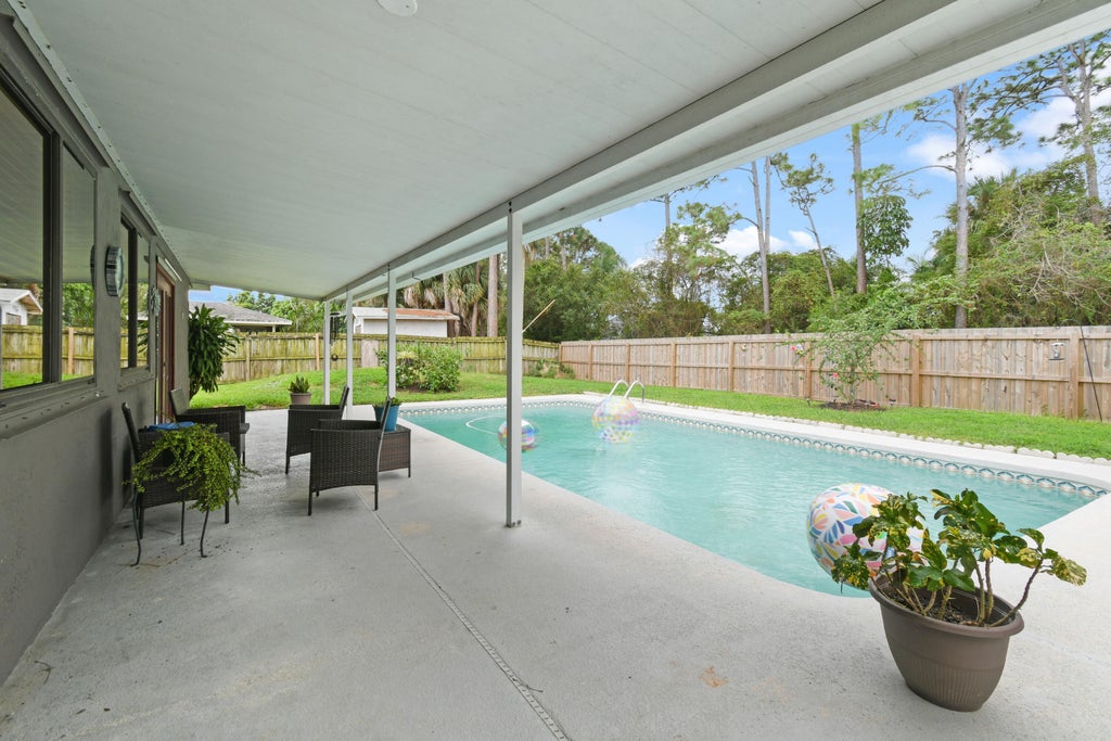 Photo of 1410 SE Manth Lane, Port Saint Lucie, FL 34983 (MLS # R10927891)