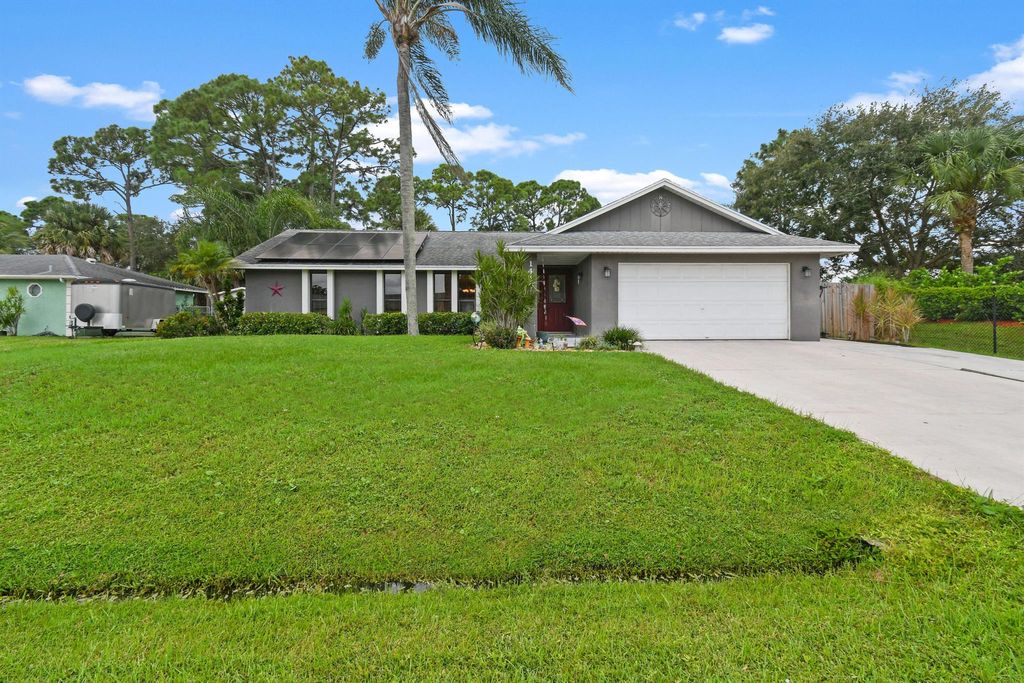 Photo of 1410 SE Manth Lane, Port Saint Lucie, FL 34983 (MLS # R10927891)