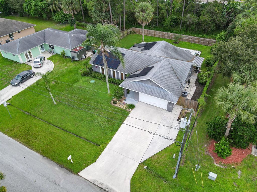 Photo of 1410 SE Manth Lane, Port Saint Lucie, FL 34983 (MLS # R10927891)