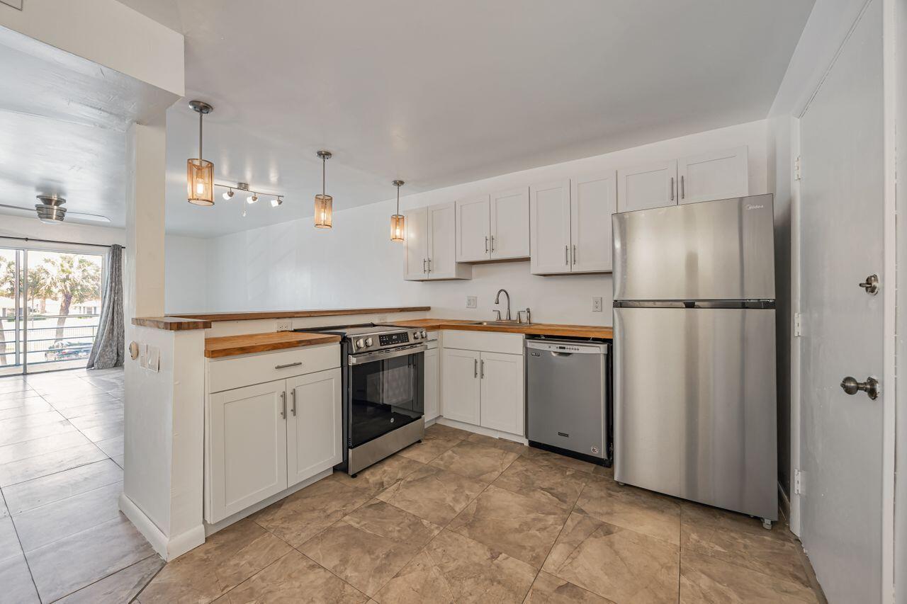 Welcome to this oversized 1-bedroom, 1.5-bathroom condo in the heart of West Boca, offering a generous 960 square feet of comfortable living space. This bright and airy unit features an open-concept kitchen perfect for entertaining, along with expansive walk-in closets and ample storage throughout. Enjoy the convenience of a newer A/C and hot water heater. Located in a well-maintained, all-age community with access to a sparkling pool and tennis courts. There is a common lobby with call box for guest entry. Close to shopping, dining, top-rated schools, and major highways -- this condo is a perfect blend of value and lifestyle!