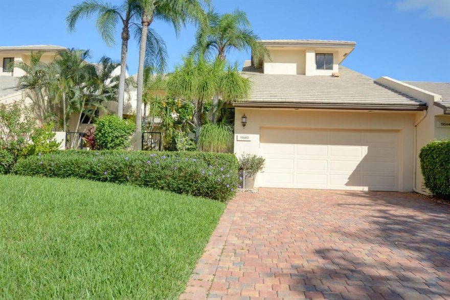 Rarely available, with one of the most spectacular views in Boca West!  Lake and golf as far as the eye can see.  This 4 bedroom, 4.5 bath two story home has a first floor master suite featuring his and her bathrooms. This updated contemporary home is very light and bright. The kitchen has white cabinets, stainless appliances and granite counters. Mexican tile flooring, cedar closet, sit down bar and a screened in Florida room make this home very special. There is an open pool with an extended deck for comfortable seating around the pool, as well as the screened Florida room, all looking out to the most beautiful view! Mandatory Membership $70,000.