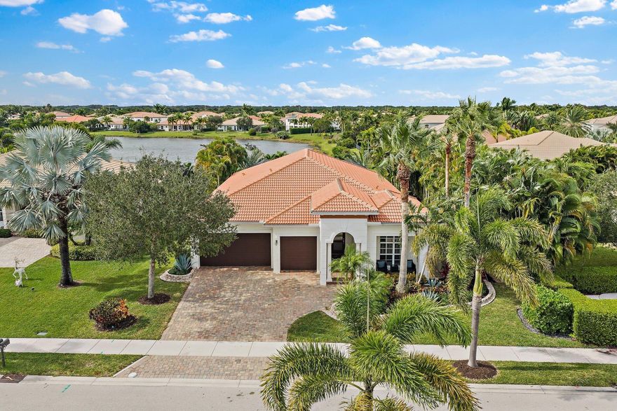 Discover this beautifully updated 4-bedroom, 3-bath lake front home located in the prestigious gated community of Rialto. Designed for elegance and comfort, the residence features soaring 10-foot ceilings, abundant natural light, impact-glass windows, and spacious 3-car garage. The open floor plan includes a large private ensuite bedroom with separate entrance perfect for guests or multi-generational living. The expansive primary suite offers an oversized custom walk-in closet, and a spa-inspired bath with whirlpool tub, dual vanities, and direct access to the lanai. The newly remodeled kitchen showcases quartz countertops, stainless-steel appliances, and a functional design ideal for everyday living.