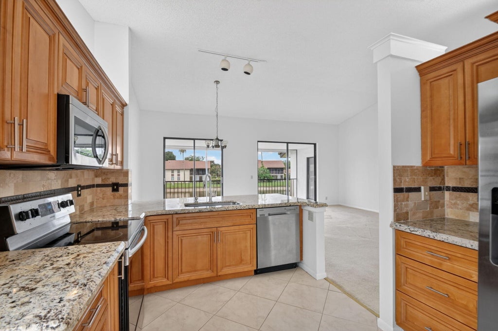 Photo of 10231 N Circle Lake Drive #201, Boynton Beach, FL 33437 (MLS # B26039804)