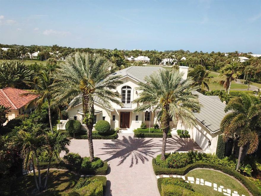 Four bedrooms, a library and five and a half bathrooms with more than 5000 square feet of refined living. Island kitchen with adjacent family room. Beautiful pool and spa. Spectacular views of the Golf Course and lake.