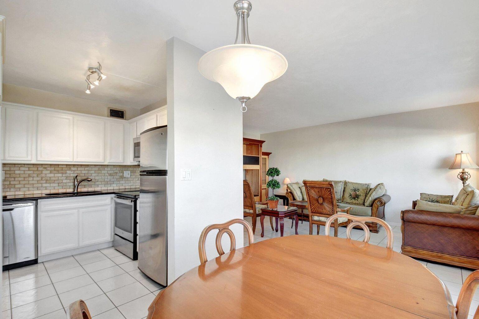 Bright updated 2 bedroom, 2 bath condo. This home features ceramic tile throughout, granite countertops, stainless steel appliances, and patio access from the master bedroom. Very clean move-in ready. Steps away from beautiful Lake Osborne and walking/cycling path. Full accordion hurricane shutters. Well located near shopping, beach, highway and airport.