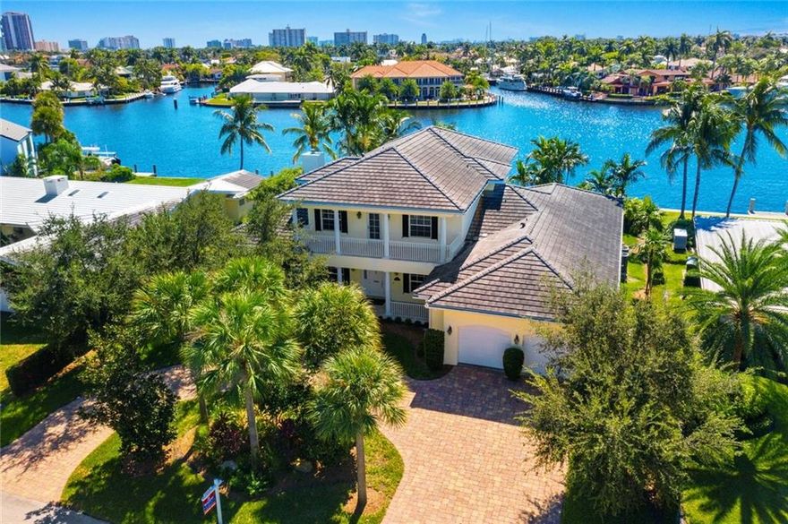 Front and center open water views of the Middle River in Gated Sunrise Intracoastal.  Features include stately foyer entry with soaring ceilings, floating staircase, elevator, chef's kitchen, walk-in pantry, 3 fireplaces, 3 built-in wet bars, covered porches and more.  4 Bedrooms, 4 and one half baths. Formal Dining & Living Rooms plus large Family room with extensive views of the Middle River. Laundry rooms on both levels. Over sized lot with 109 feet of water frontage and solid concrete dock. Direct ocean access. Southern exposure with views of downtown Fort Lauderdale and the beach skylines. Great house for entertaining! Full house Generator. Bayview Elementary school district. Walking distance to the beach, shopping and restaurants. A must see!