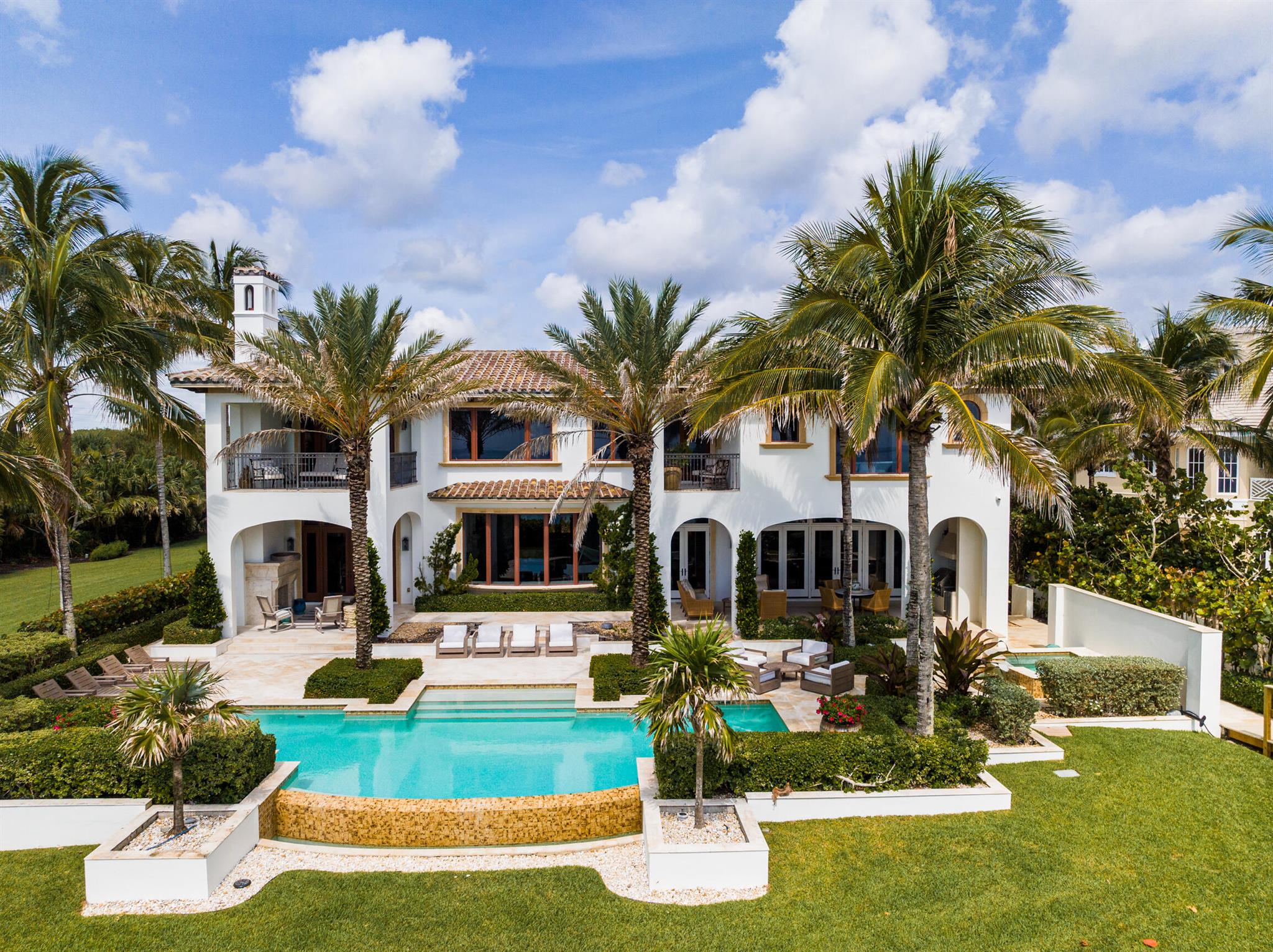 A rare treasure. This beachfront home offers incredible ocean views, beautiful landscaping, a two-level office/library, chef's kitchen, formal and family dining and living rooms, and a dreamy master suite. Significant updates were made in 2023, including a new dune crossover leading you directly from your pool to the beach. This is a host's dream with a kitchen-adjacent serving bar, movie theater that seats over fifteen people, entertainment room with a full bar, outdoor kitchen, detached guest house, and a large beachfront pool space.Within 10 mins:Orchid Island Golf and Beach ClubDisney Vero Beach ResortBermuda ClubSea Oaks Beach and Tennis ClubGolden Sands Beach ClubWabasso BeachTreasure Shores Beach ParkPelican Island Wildlife RefugeJungle Trail