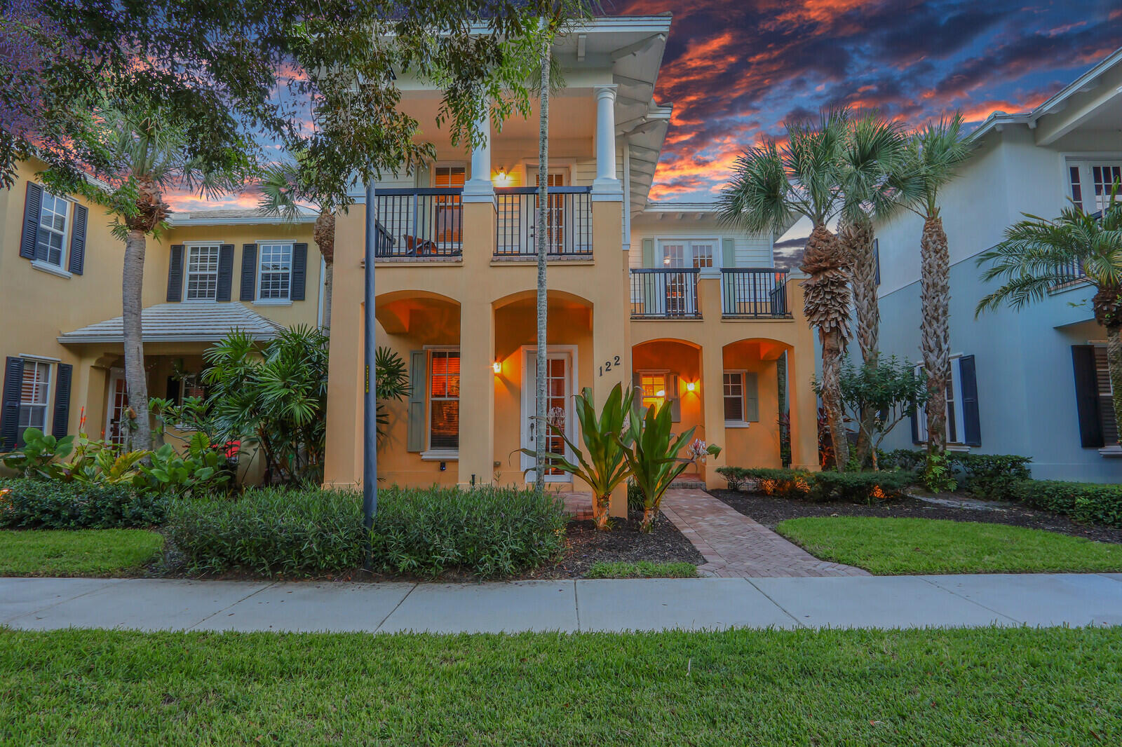 Welcome to this beautifully renovated 3-bedroom, 2.5-bath CBS home in the highly desirable Botanica community, perfectly situated in the heart of Jupiter. This spacious two-story residence offers nearly 2,200 sq ft of living space (3,500 sq ft total) with an open kitchen with newer stainless-steel appliances, cherry wood flooring, and soaring volume ceilings. The main level includes a versatile den, while all three generously sized bedrooms are located upstairs, all with private balconies. Step outside to your own private courtyard oasis featuring a covered patio, lush landscaping & sparkling swimming pool - ideal for relaxing or entertaining. A detached two-car garage is connected by a covered walkway for added convenience. Botanica offers outstanding amenities including