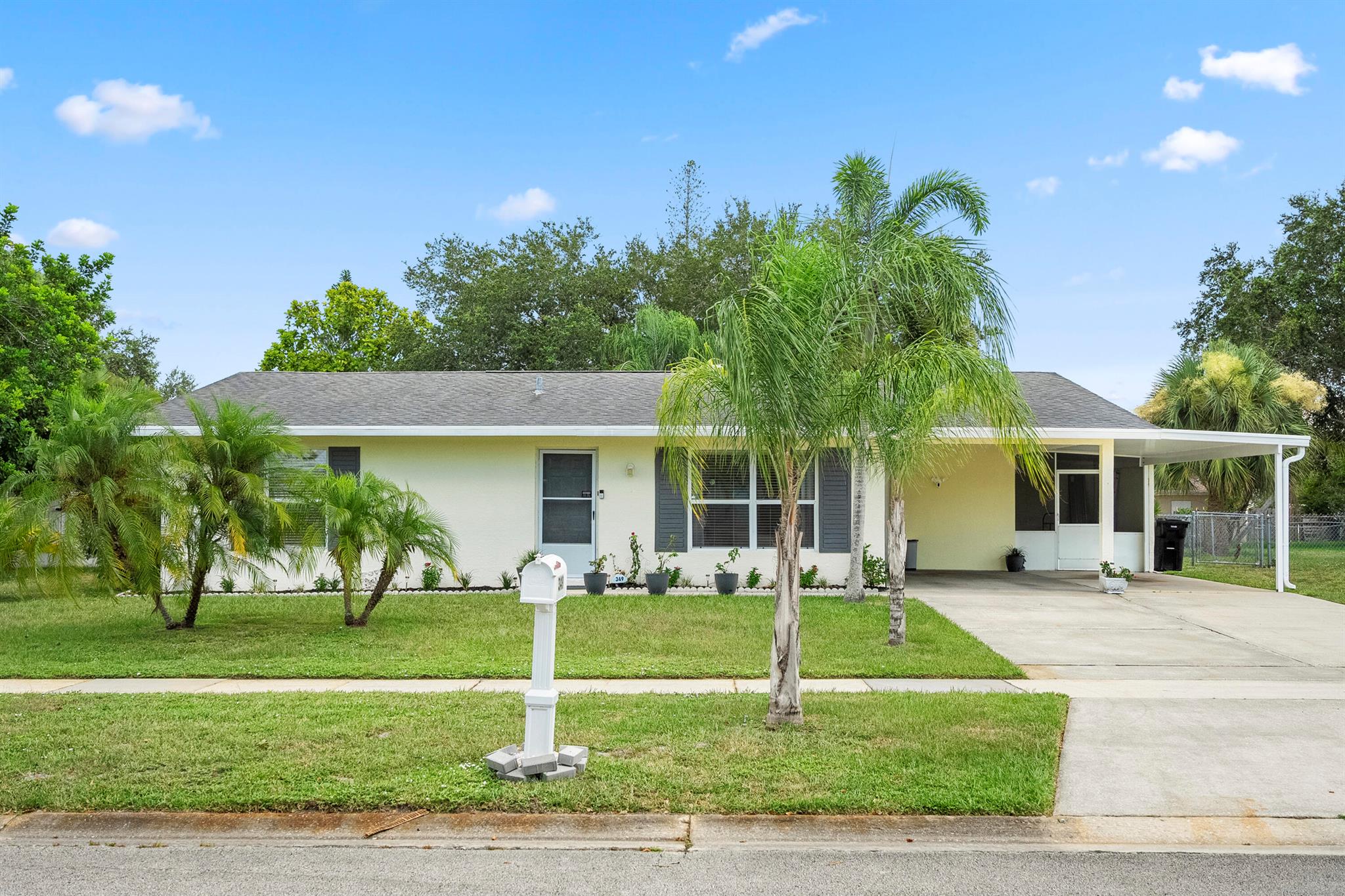 Charming 2-bedroom, 2-bathroom home in the heart of Port St. Lucie. This well-maintained property features a spacious living room with wood-look flooring, a bright kitchen with classic tile countertops, and a large family room perfect for entertaining. Enjoy the outdoors on the covered patio overlooking the backyard. Recent updates include a new water heater. Roof installed in 2017. Located in a quiet, established neighborhood with easy access to local shops, dining, and parks. Move-in ready and easy to show!