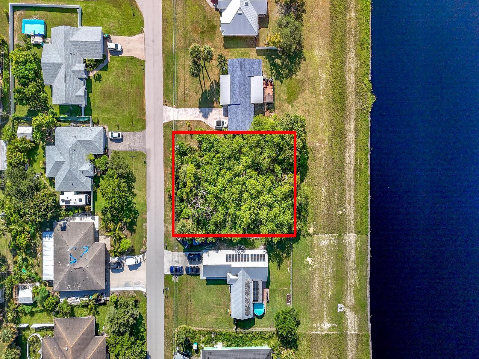 Located on the C-24 Canal - Builders & Investors alike will see the potential in this spacious 125’x80’ lot. Great location with freedom to build - in a boat and RV-friendly area with No HOA! The Large C-24 canal is 160 feet wide, offering the ideal location to enjoy fishing, kayaking, jet skiing, stand up paddle boarding and unforgettable sunset views. This rare opportunity is located in one of Florida’s most charming and vibrant beach towns-Port St. Lucie’s famous laid-back lifestyle is ideal for anyone planning to build your primary residence, a vacation home, or a smart long-term investment. Don’t miss this opportunity to turn your dream into a reality. Please allow up to 72 hours for a response. DO NOT SUBMIT OFFERS SIGHT UNSEEN.