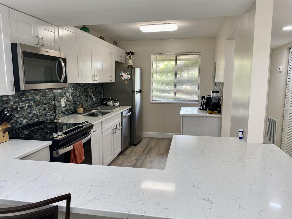 Photo of 4501 Fountains Drive S #106, Lake Worth, FL 33467 (MLS # B26030910)
