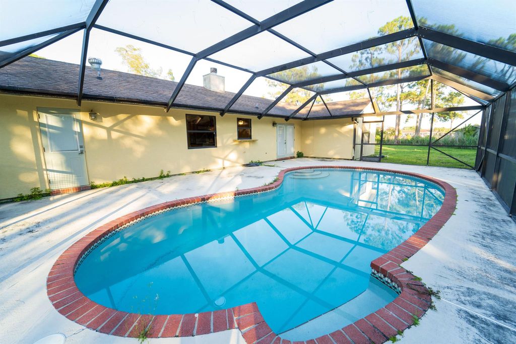 Photo of 16030 Okeechobee Boulevard, The Acreage, FL 33470 (MLS # R10894853)