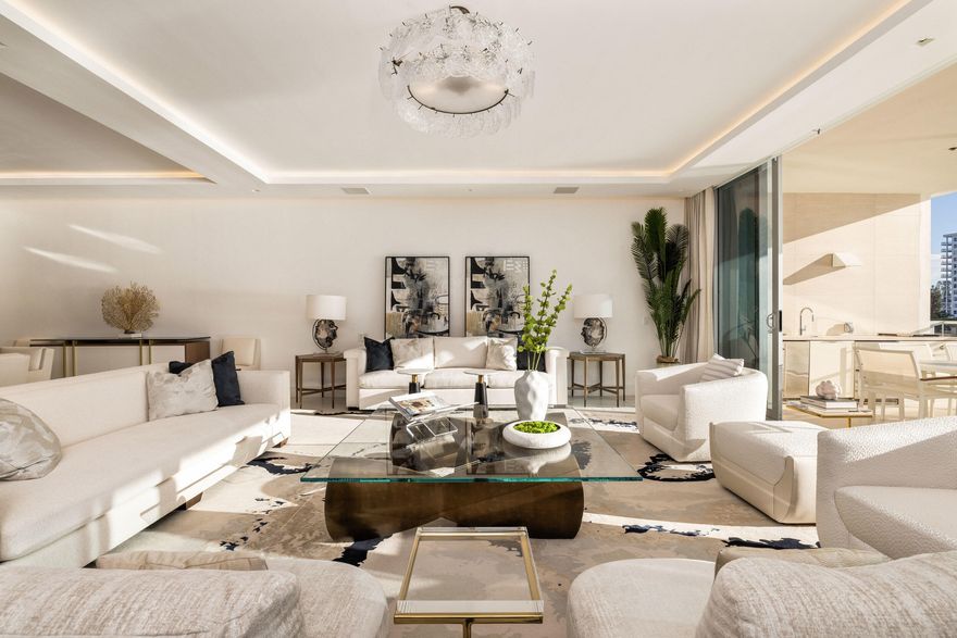 Penthouse 2 at Boca Beach Residences is a rare, fully furnished waterfront offering with sweeping views of Lake Boca and the Atlantic Ocean from every guest suite. This 4-bedroom + den, 3.5-bath residence features a spacious flow-through layout with over 600 square feet of private outdoor space--including two terraces, one with a summer kitchen overlooking the Intracoastal. A private boat slip is included, offering direct access to South Florida's premier waterways. Every detail of this designer-finished residence reflects the essence of elevated coastal living. Wide-plank white oak flooring, floor-to-ceiling glass, custom motorized blinds, outfitted closets, and curated wall coverings create a sophisticated and harmonious interior. The chef's kitchen is appointed with Italian smoked-glass cabinetry and top-of-the-line Gaggenau appliances, including a gas cooktop, wine cooler, and paneled refrigerator/freezer. The primary suite is a true sanctuary, featuring a custom Poliform wardrobe and a spa-inspired bath with dual waterfall vanities and LED-lit mirrors. Each guest suite opens to a private terrace, offering both comfort and seclusion. Located on 3.2 acres of prime lakefront, Boca Beach Residences is an exclusive enclave of just 32 homes directly across from the Boca Raton Resort & Club. Residents enjoy semi-private elevator access, smart-home technology, and boutique amenities including a private marina, lakefront pool and spa, yoga lawn, lakefront boardwalk, Aqua Room for water sports storage, five-star concierge, valet, and private underground garages all surrounded by lush tropical landscaping by Raymond Jungles and architecture by Sieger Suárez.
This is waterfront living redefined turnkey, refined, and effortless.