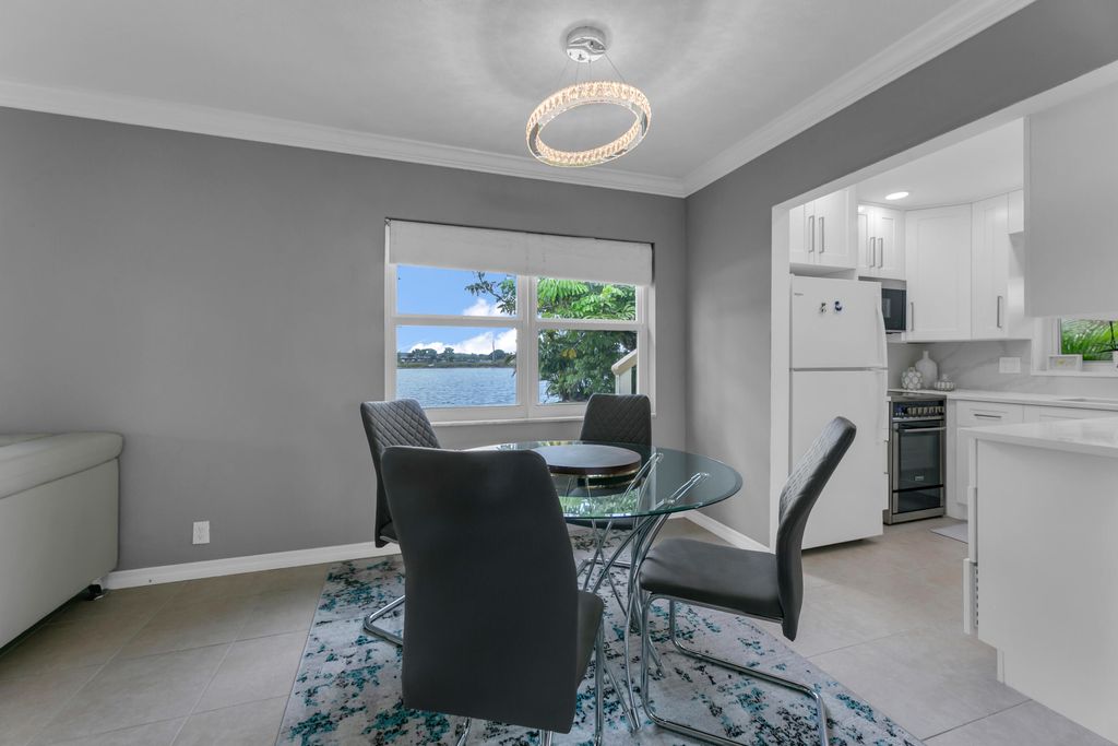 Photo of 960 Crystal Lake Drive #115, Deerfield Beach, FL 33064 (MLS # R11159578)