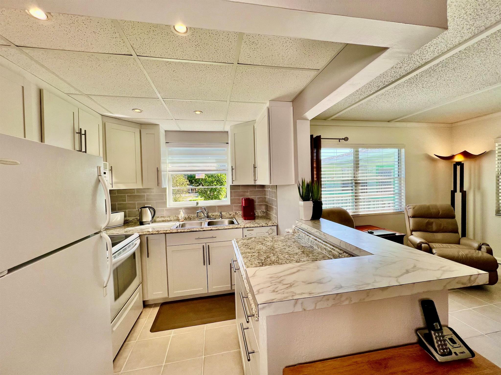 Beautiful Rentable Corner Unit in Century Village East, offering a Club Med-style living experience with serene lake views. Impeccably maintained and tastefully decorated, featuring smart storage solutions. Fully furnished and turn-key. Renovated with new tiles, open kitchen, modern cabinets, new roof, updated electric panel, new water heater, and AC replaced in 2019. No special assessments! Enjoy resort-style amenities and a vibrant community--just move in and start living the dream!
