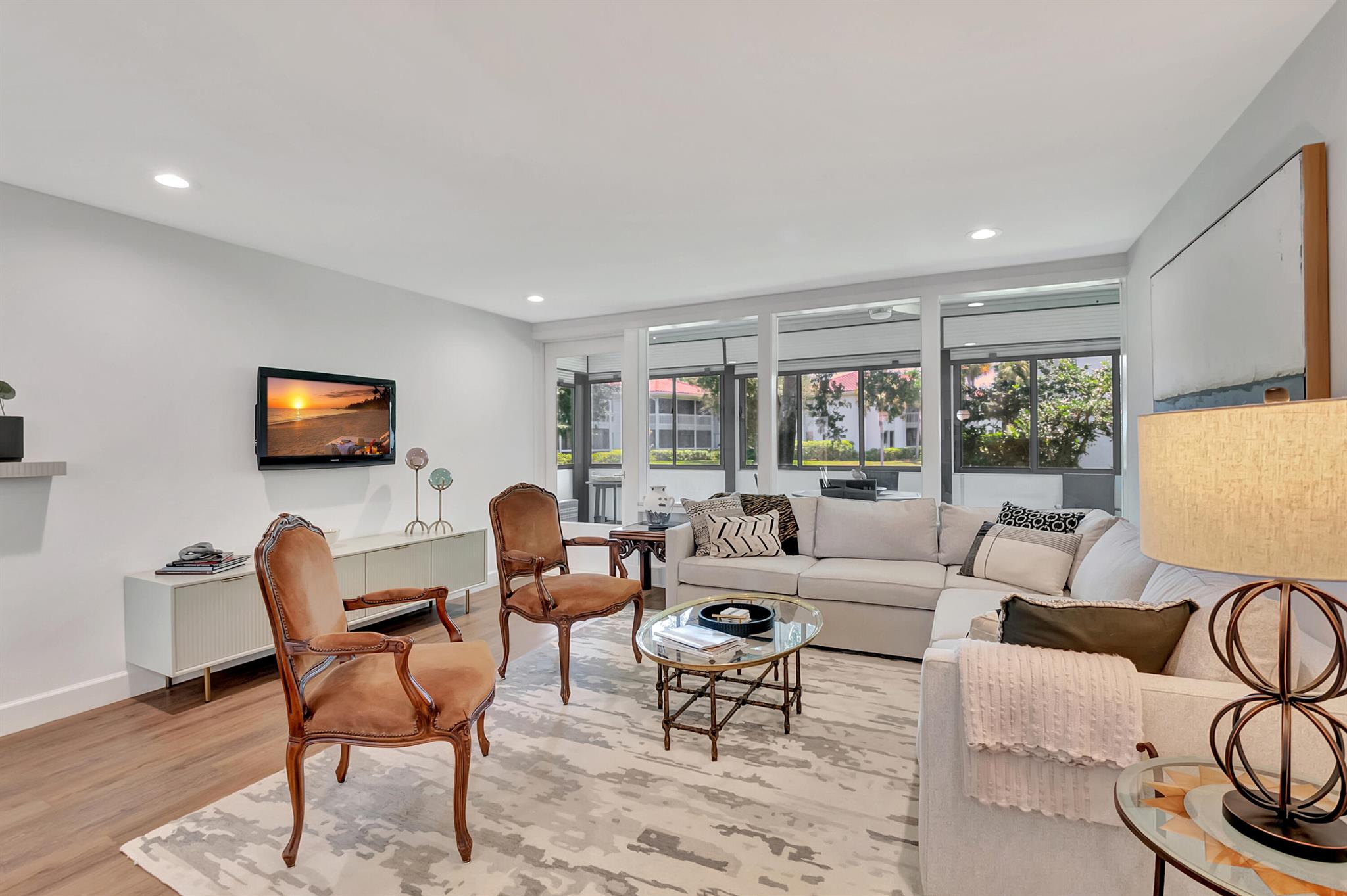 Rarely available stunning and recently renovated, 1st floor, 2 BR, 2 BTH condo in Quail Hollow. This contemporary and sophisticated property is move in ready with designer finishes. Featuring split bedrooms with ensuite baths, luxury vinyl wide plank flooring, open kitchen, full laundry room, walk in closets and acrylic window sliders on covered patio with southern exposure where you can relax and enjoy the lake views. ~Imagine life inside the Nation's #1 Private Residential Country Club Lifestyle offering resort-style living. PLAY our 4 Golf courses, 27 Tennis courts and 14 Pickleball courts; SHOP our retail store, golf and tennis pro shops, DINE in our 10 dining venues. Mandatory Joining Fee: $115,000, BWMA Capital Contribution: $10,000, Annual Social Dues: $20,394.