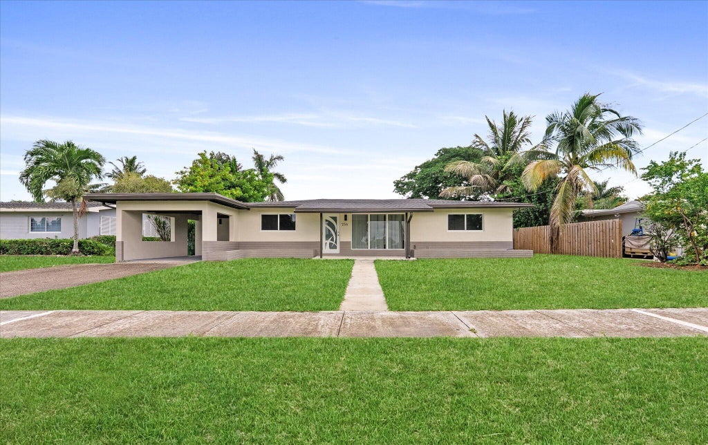 Photo of 256 GREENBRIER Drive, Palm Springs, FL 33461 (MLS # B26070090)