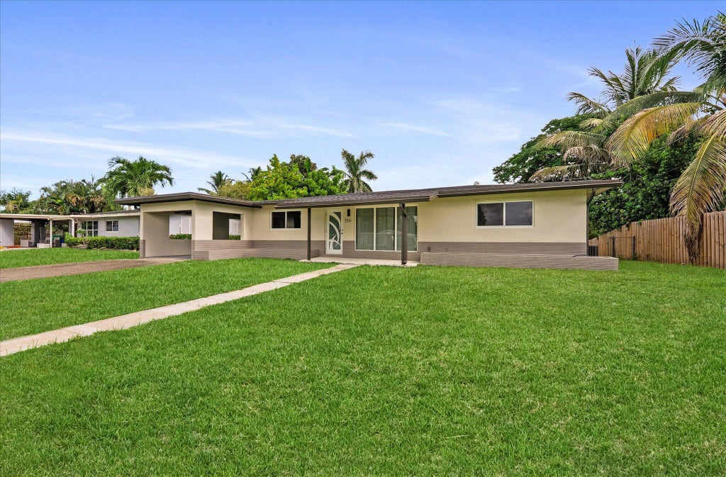 Photo of 256 GREENBRIER Drive, Palm Springs, FL 33461 (MLS # B26070090)