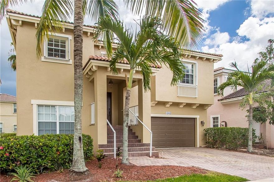 THIS BEAUTIFUL TWO STORY HOME FEATURES A FOYER ENTRANCE, FORMAL LIVING & DINING ROOMS, FAMILY ROOM, COMPUTER NICHE, SPLIT BEDROOMS WITH AN UPSTAIRS MASTER AND TWO BEDROOMS DOWNSTAIRS!FRESH PAINT INSIDE AND OUTSIDE, TILE AND NEW WOOD LAMINATE FLOORING, WOOD KITCHEN CABINETS & CORIAN COUNTERS! TROPICALLY LANDSCAPED LOT, OPEN BALCONY AND COVERED PATIO.  HOA FEES COVERS THE GATED ENTRANCE, CABLE, ALARM, LAWN CARE, COMMUNITY POOL, TENNIS AND FITNESS CENTER! GREAT CORAL SPRINGS LOCATION AND TOP RATED SCHOOLS!