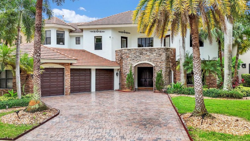 Step Into Your PRIVATE OASIS in a EUROPEAN CASTLE - INSPIRED ESTATE.Nestled in Versailles, Wellington's premier gated community, this elegant residence is just 10 minutes from world-famous equestrian arenas. It offers 5 spacious bedrooms, including a lavish master suite with a private terrace shaded by palms and overlooking the lake.Inside, enjoy natural wood finishes, custom closets, and refined details throughout. The home features a private office, media/meeting room, grand lounge with card table, and a stylish bar flowing into the chef's kitchen.Outdoors, relax in a sparkling pool, jacuzzi, private gym, and hammock lounge, all with breathtaking lake views.