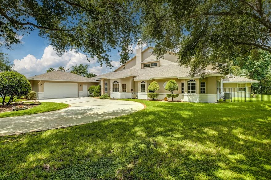 PRICE IMPROVEMENT! A custom designed home that boasts walking distance to the best schools in Broward, a chefs kitchen, enormous living spaces and breathtaking backyard views. With 4 bedrooms, loft & 3.5 baths, every room is oversized and offers endless possibilities. This magnificent home features a gourmet kitchen equipped w/ high-end SS appliances, custom cabinetry, butcher block island, & huge walk-in pantry. The kitchen flows into the large living area complete with vaulted ceilings and a wood fireplace. The huge primary suite comes equipped with a luxurious en-suite bathroom with marble floors, & an enormous walk-in closet with custom cabinets. The property sits on 3/4 acres with golf course views, and features immaculate landscaping, covered gazebo and sparkling pool. Features Include: * 2020 Roof* Two wood burning fireplaces* Exterior freshly painted * Full hurricane protection* PVC sewer pipes* Hardwood floors* Granite countertops* Huge balcony facing backyard with amazing golf course views* 3/4 acre lot