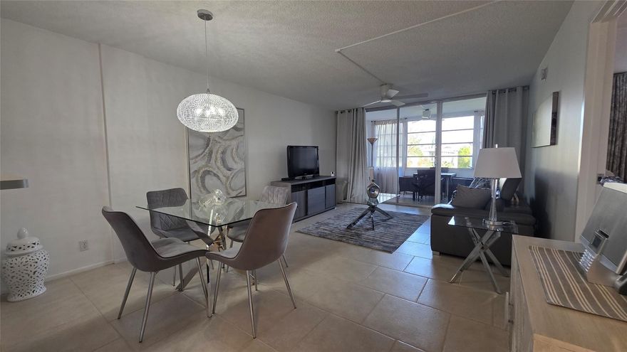 Welcome to this beautifully decorated one-bedroom condo located in a desirable 55+ community. This charming residence features elegant tile flooring throughout, creating a clean, cohesive look that’s both stylish and easy to maintain.The interior has been thoughtfully designed with tasteful décor, offering a warm and inviting atmosphere from the moment you walk in. The spacious living area flows comfortably into the dining space, making it perfect for relaxing or entertaining guests. The bedroom is generously sized with ample closet space, providing comfort and functionality.The furniture is negotiable, offering a fantastic opportunity for a move-in-ready experience if desired.