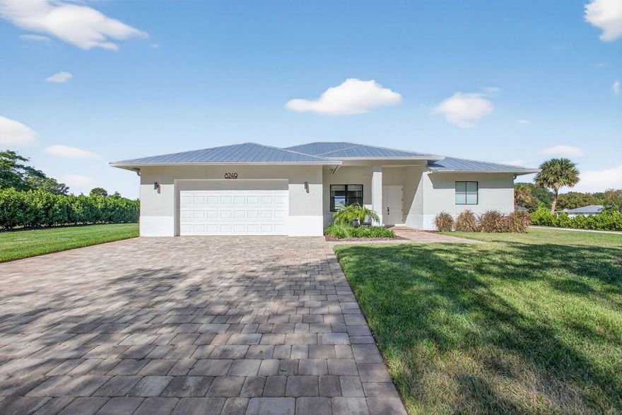 Introducing a stunning 4-bedroom, 3-bath, 2,205 sq ft newer-construction home perfectly positioned off the highly coveted Gomez Avenue—one of Hobe Sound's most prestigious and sought-after corridors. Set on an expansive property and located just 2.5 miles from the pristine beaches of Jupiter Island, this residence offers the ideal blend of luxury, privacy, and true Florida coastal living.
Step inside to soaring 10-foot ceilings, 8-foot interior doors, and a bright, open-concept layout that showcases exceptional craftsmanship. The spacious great room flows effortlessly into a designer kitchen featuring premium cabinetry, sleek countertops, stainless-steel appliances, and an oversized island ideal for gathering and entertaining.
The private primary suite provides a peaceful retreat with with generous closet space and a spa-inspired bathroom complete with dual vanities and a walk-in shower. Three additional guest bedrooms and two beautifully appointed bathrooms are thoughtfully positioned to offer comfort and flexibility for family or visiting guests.Oversized impact windows and sliders invite natural light throughout and open to a large covered lanai, overlooking an expansive backyard with limitless possibilitiesadd a pool, create an outdoor kitchen, build additional living space, or bring your boat or RV. With no HOA, you have the freedom to customize the property to fit your lifestyle.Situated in one of Hobe Sound's most desirable areas, this home offers unmatched convenience. You're just minutes from boutique shops, top-rated schools, the Hobe Sound Nature Center, championship golf, waterfront dining, and the turquoise waters of Jupiter Island.A rare opportunity to own a luxury residence on the Gomez corridorwith acreage, privacy, modern construction, and beaches only 2.5 miles away. This is coastal South Florida living at its finest