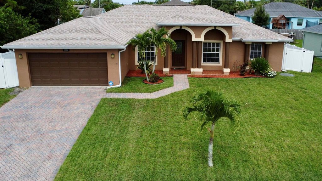 Photo of 2971 SW Rosetta Street, Port St Lucie, FL 34953 (MLS # R10900635)