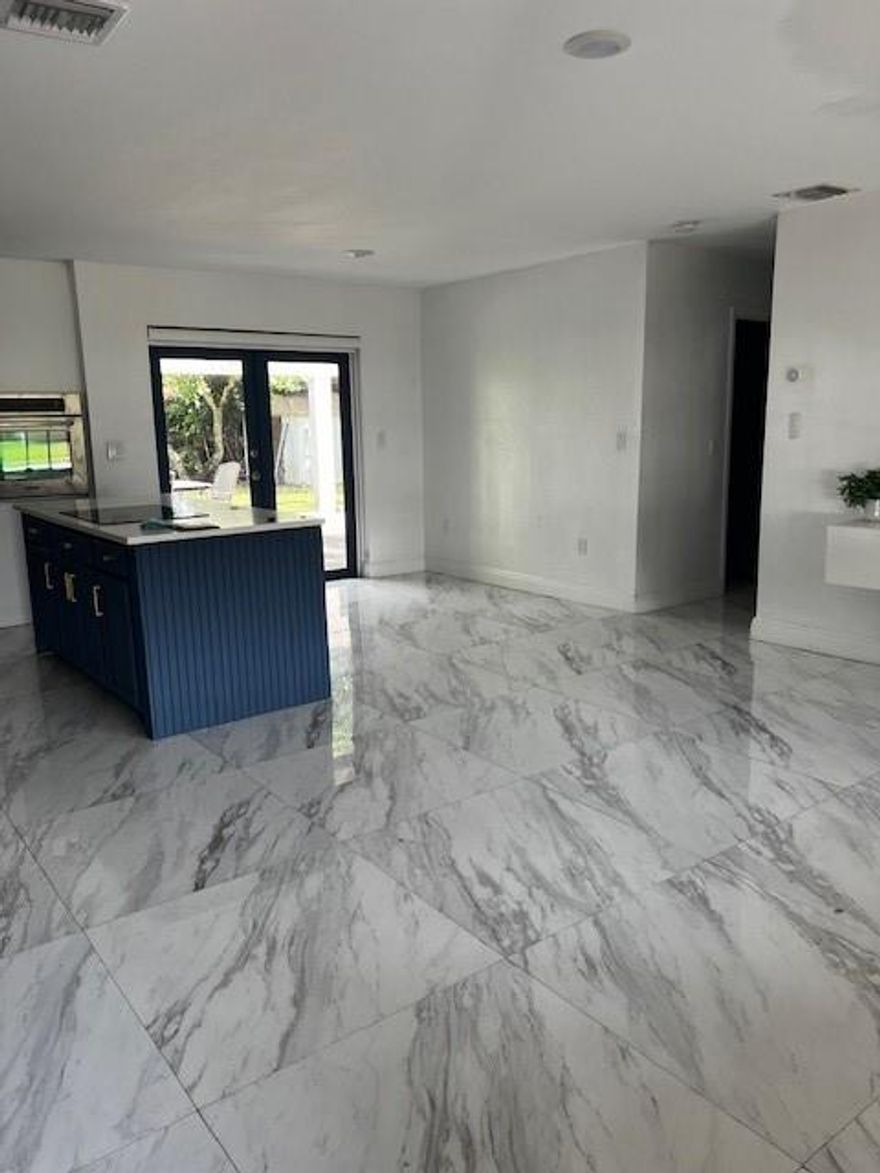 Beautiful single family home 2 Bedrooms 1 Bath the house features tile floors, new bathroom, open remodeledkitchen with quartz counter top. Water filtration system through out, instant hot water heater, central air/heat,interior laundry room w/full size Washer/Dryer. Huge yard that is fenced for for Privacy & Located in a quietneighborhood. Rent includes water/sewer, garbage. Tenant responsible for electricity & landscaping. Landlord will inspect the property once every 3 months. Please NOTE - The garage has been converted into a 1/1 efficiencyand is rented separately.