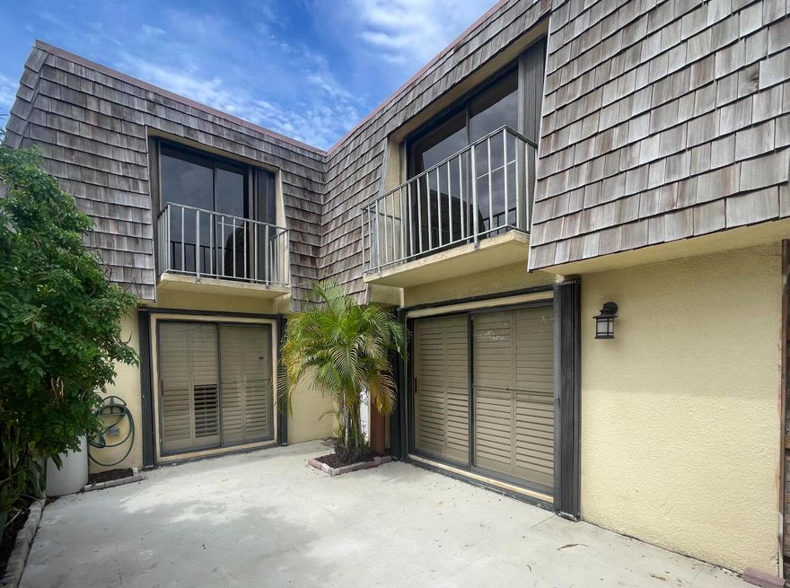 Great location in a family oriented community in the heart of Palm Springs. This 2/2 townhouse has been freshly painted. Features: wood kitchen cabinets with granite countertops and plenty of cabinet space, stainless steel appliances, laminate floors, plantation shutters, save on electric with gas dryer and tankless water heater, accordion storm shutters throughout, large fenced in patio, open balcony, built-in shelving, laundry closet, a decorative fireplace, community park and picnic area, PET FRIENDLY. Prime location close to shopping, restaurants, downtown, beaches, I95, walk to Publix in Greenwood Shopping Plaza. Make this charm your home!