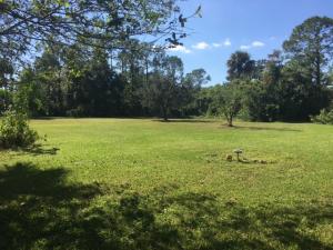 1.06 ACRES ON A CLEAR LOT. NARROW CANAL RUNS ALONG THE BACK OF THE PROPERTY FOR DRAINAGE. ON PAVED ROAD NEAR FIRE STATION (ON THE SAME GRID AS FIRE STATION). PRIVATE DRIVEWAY INTO THE PROPERTY. FENCED ON 3 SIDES.