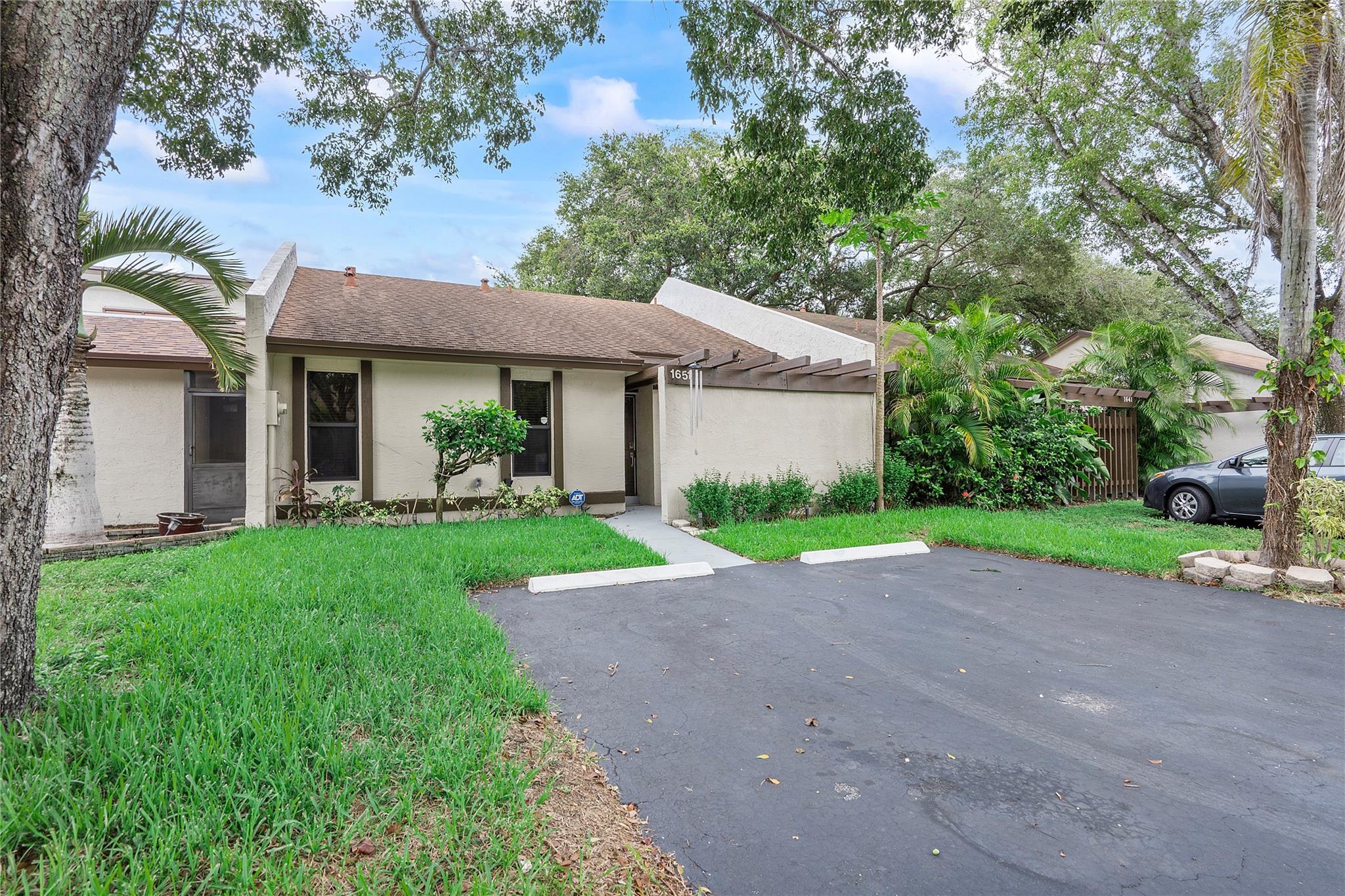 Here’s your opportunity to own in one of Pembroke Pines’ most convenient neighborhoods — no gated community, low HOA, and smart living at a great value. This 2-bed, 2-bath townhome is move-in ready — skip the repairs and start living from day one. The layout is efficient and comfortable, with a spacious primary suite that includes two walk-in closets — a rare perk at this price. Outside, enjoy a private screened terrace and extended patio, offering a backyard space that’s uncommon in similar homes. Plus, you’ll have two parking spots right at your doorstep. Perfect for first-time buyers ready to stop renting and start building equity. This home can even become your first income-producing property. BONUS: Seller will cover your closing costs when you use the preferred lender.