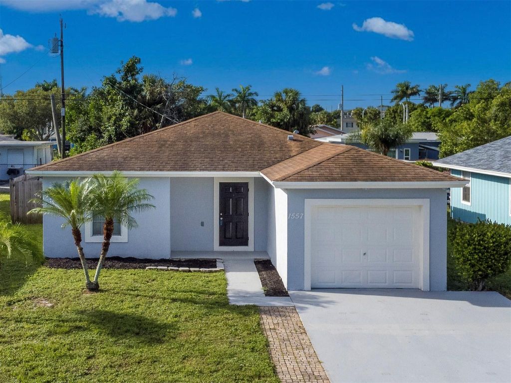 Photo of 1557 W 10th St, Riviera Beach, FL 33404 (MLS # F10401459)