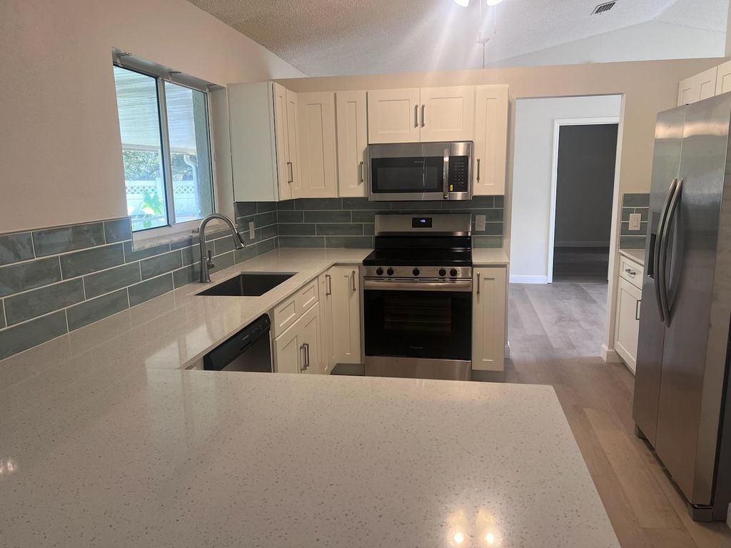 Photo of 4444 NW Hegar Place, Port Saint Lucie, FL 34983 (MLS # R10975430)