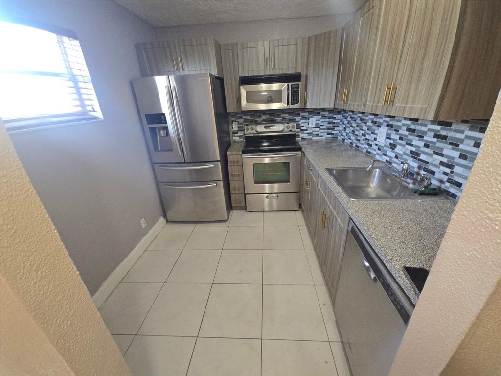 Photo of 7541 NW 16th Street #1408, Plantation, FL 33313 (MLS # F10484897)
