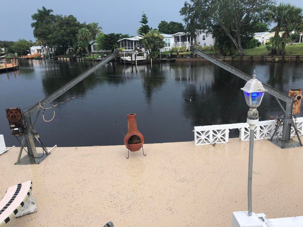Photo of 7733 SE Fork River Drive, Stuart, FL 34997 (MLS # B26016402)