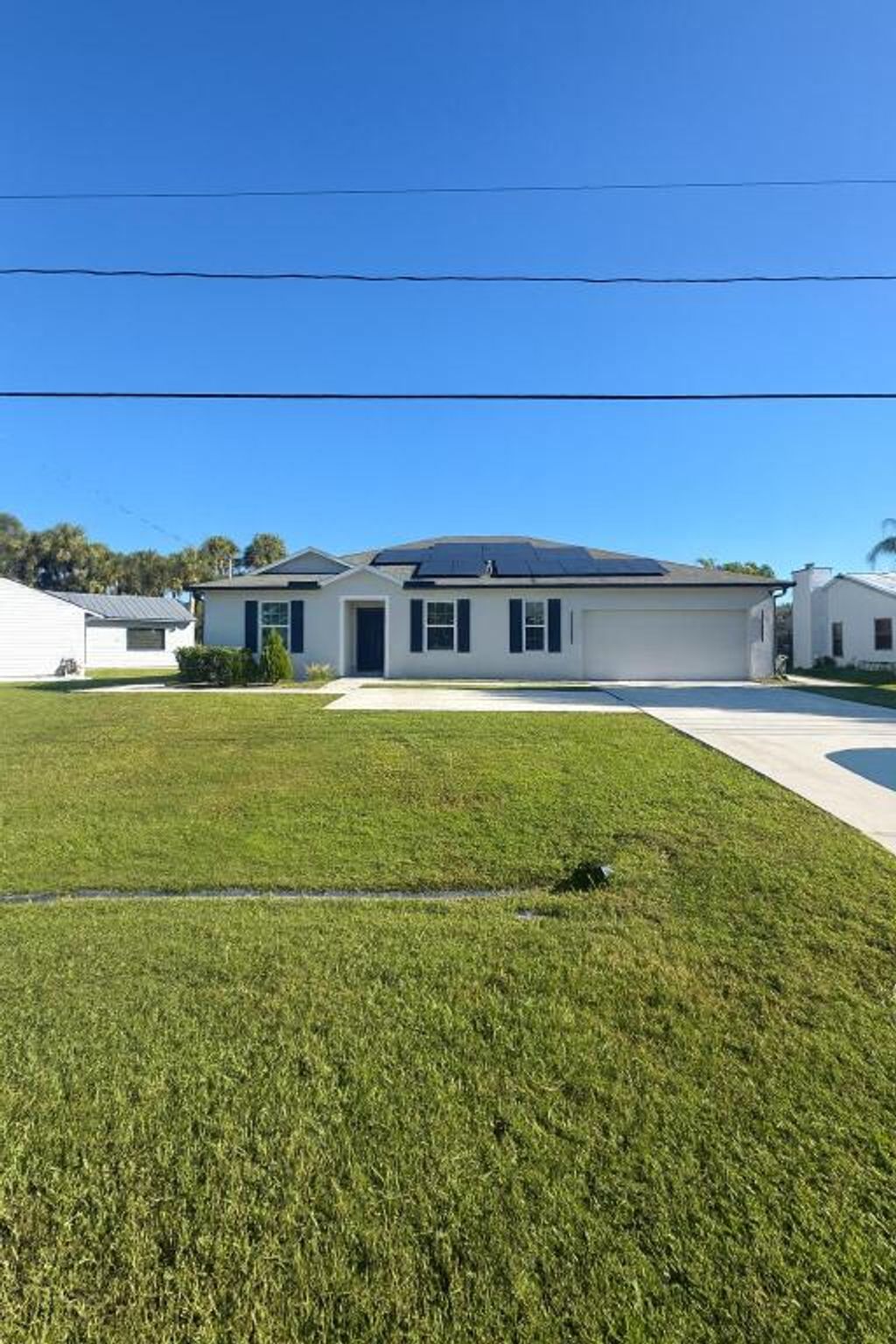 Photo of 1963 SW Import Drive, Port Saint Lucie, FL 34953 (MLS # R11142164)