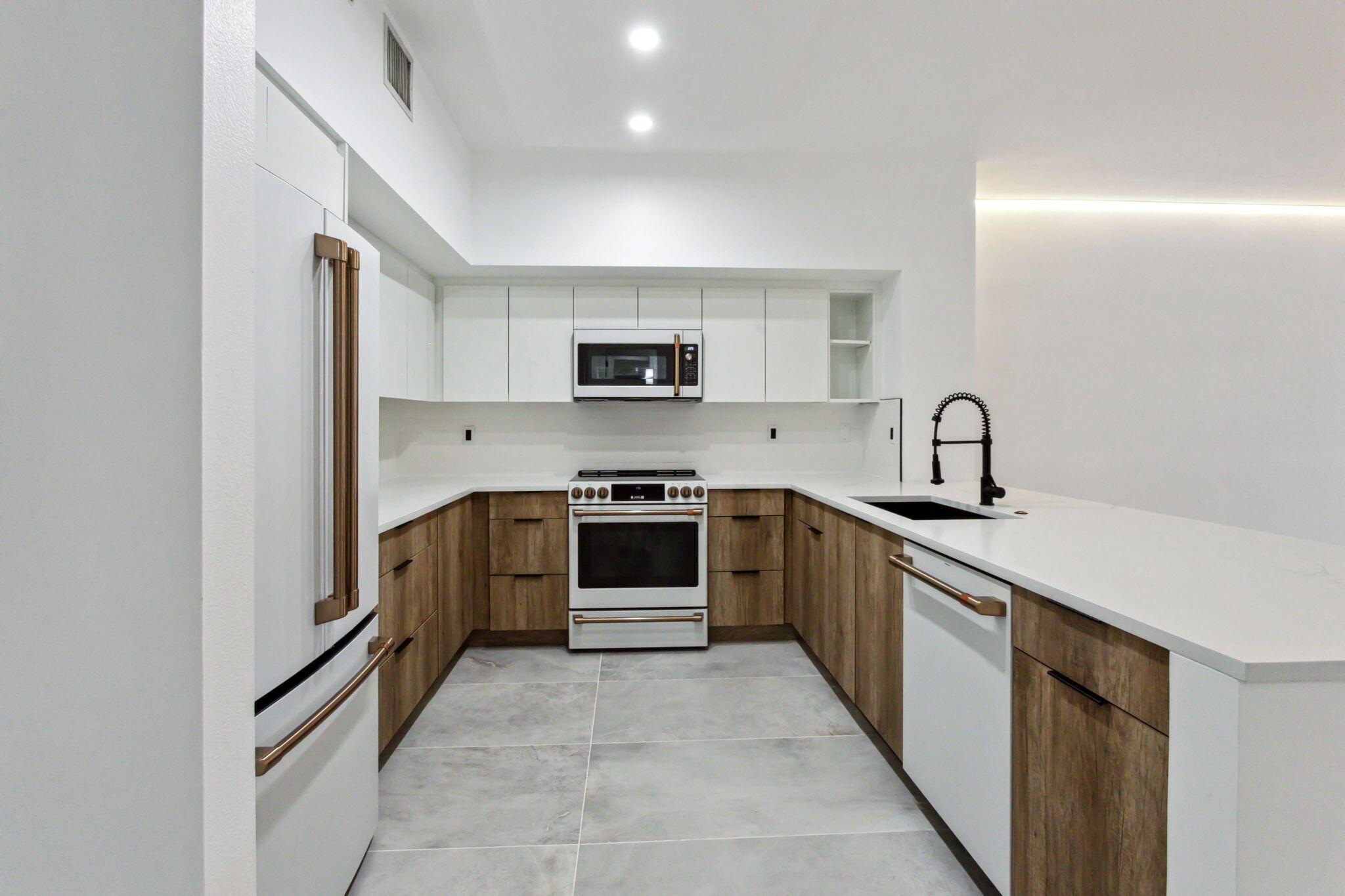 Convenient & exceptional Delray Downtown living on a quiet street just 2 blocks North of Atlantic Ave! If you want a place you would be proud to call home -- you've found it! Owner has completely remodeled this 1/1 unit with the highest quality materials and appliances. Custom lighting has been installed in the ceiling to add a soft ambiance to the rooms. Impact Windows throughout for security and sound reduction. Completely furnished, Washer/Dryer in unit. Available immediately! 1 covered, secured parking space, pool, sauna, gym, business center. Walk to the beach, world class restaurants, shopping, green market, theatre and live music venues. Toast the sunset from your spacious balcony!!