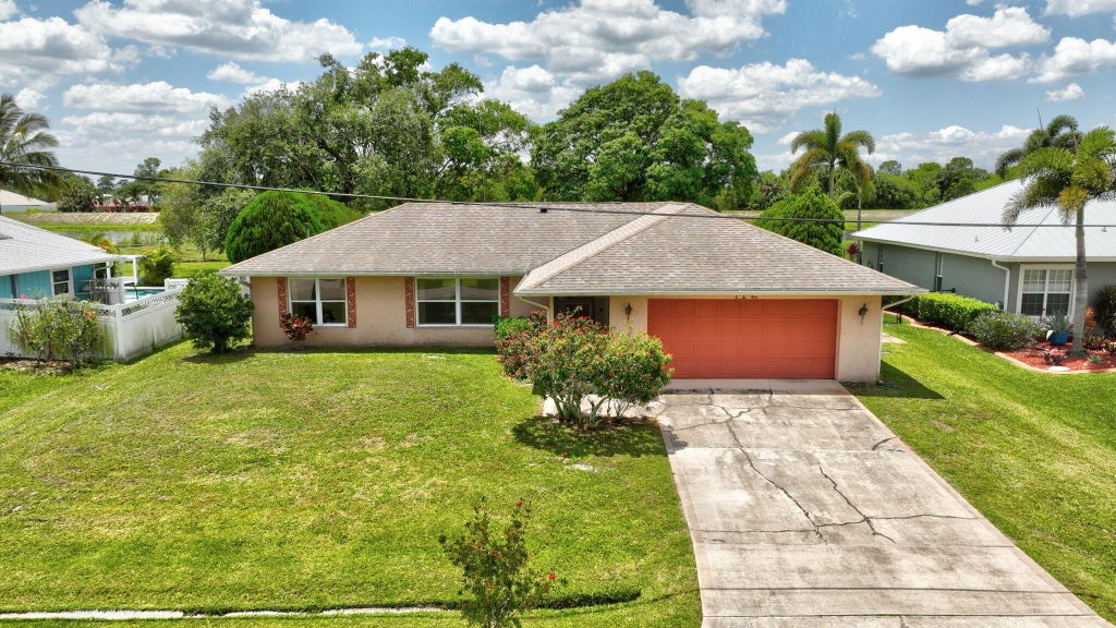 Photo of 472 SW Aster Road, Port Saint Lucie, FL 34953 (MLS # R11091396)