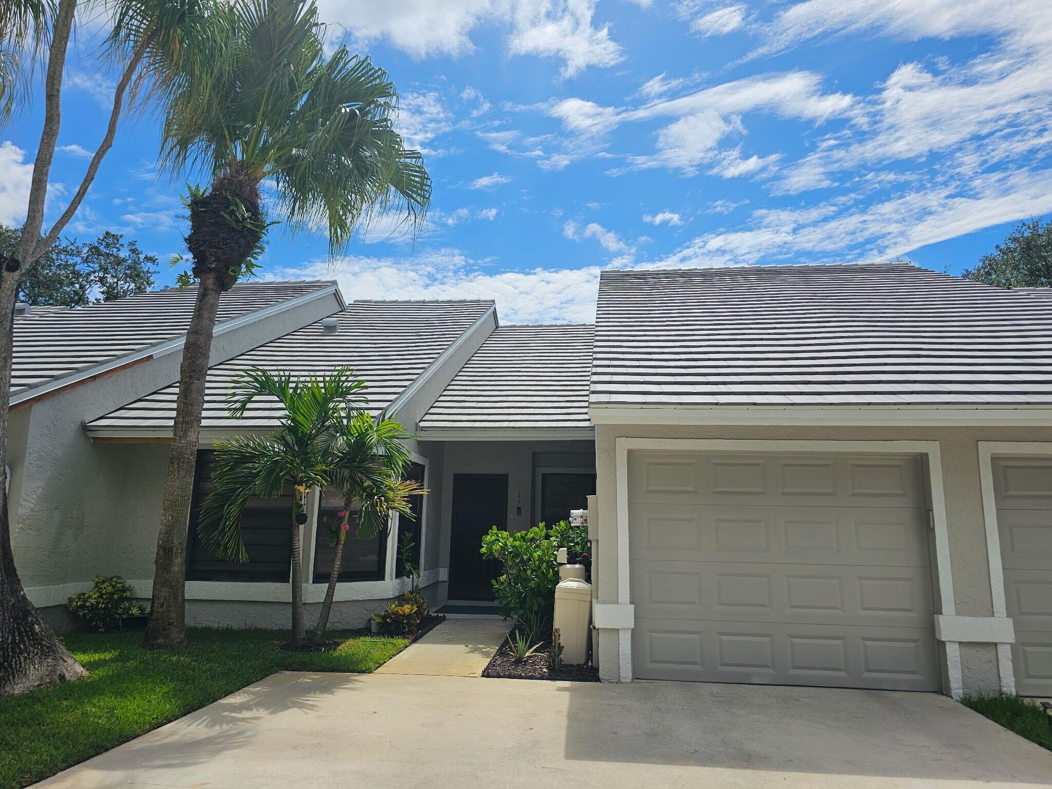 A true hidden gem!!! Stunning townhouse in Glengary at PGA National. Single level, fully renovated, spacious layout, with a single car garage with brand new garage door and a Florida sunroom/patio. Hurricane proof sliding glass doors and windows. Newer AC system. Entire house has custom made blinds, new microwave oven and refrigerator. New doors, washer and dryer, new plumbing. Custom made closets and custom-made Hunter Douglas retractable shades for skylight/remote/solar panel. House is in PERFECT CONDITION!!! A MUST SEE!!! Buyer to pay roof assessment of $21,630 as new roof was just completed in July 2025.