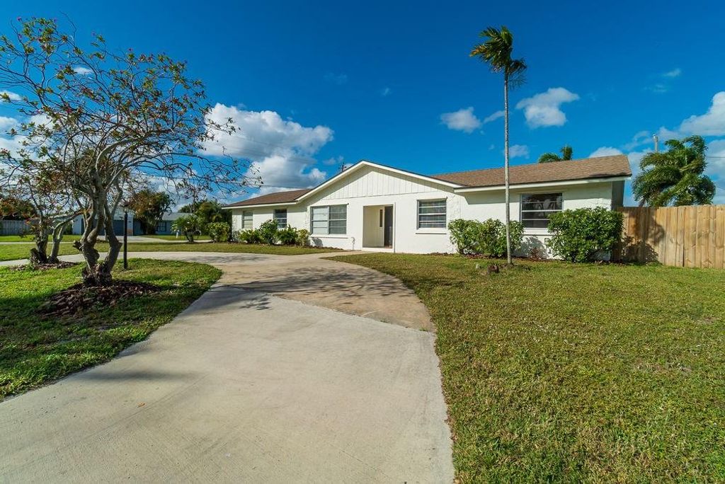 Photo of 3119 Tropical Trl, Lake Worth, FL 33462 (MLS # F10265543)