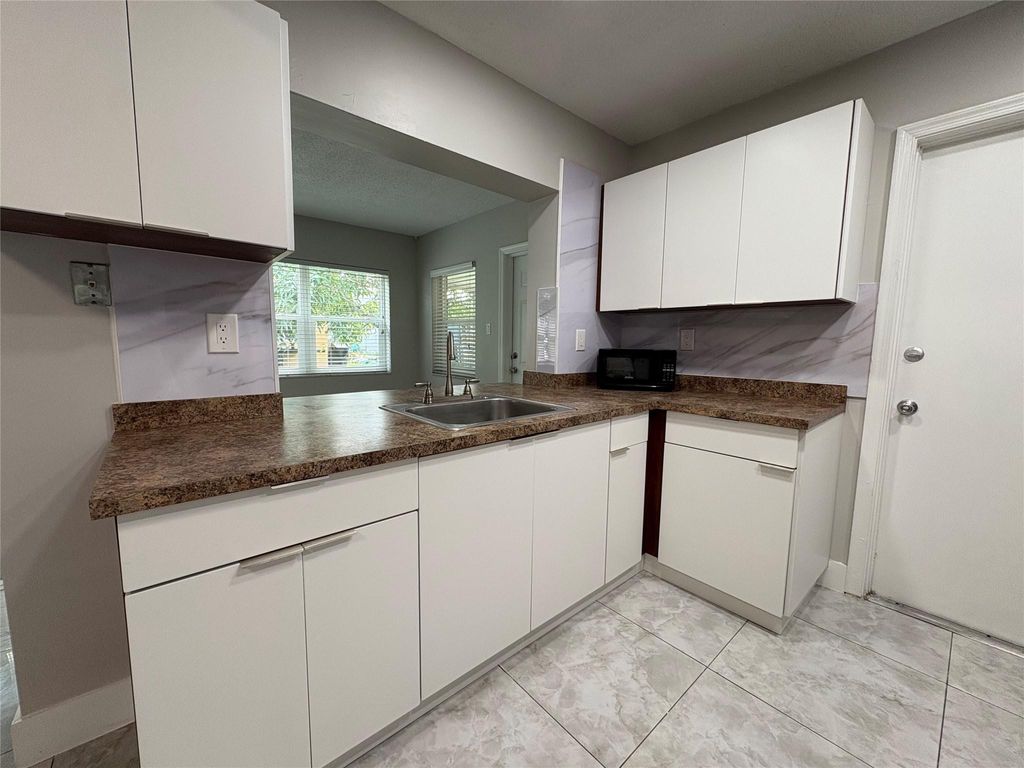 Photo of 6712 NW 60th Street, Tamarac, FL 33321 (MLS # F10532312)