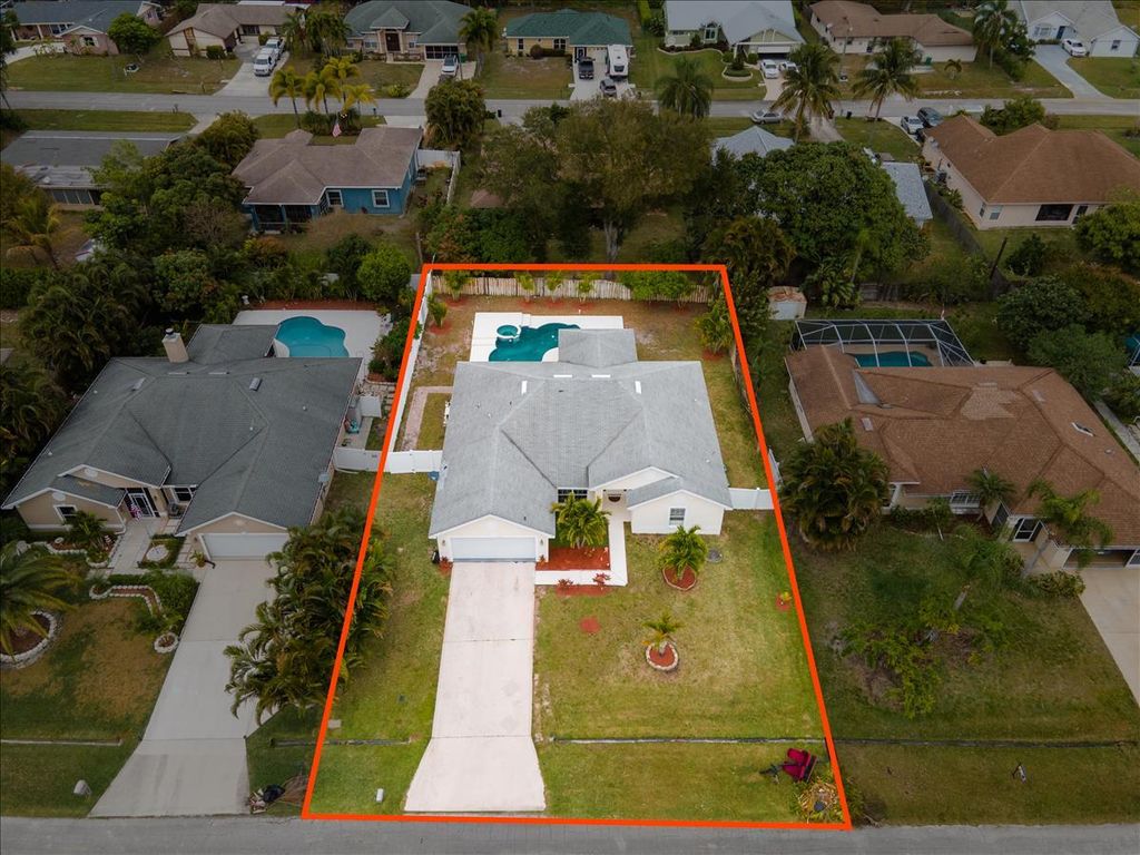 Photo of 961 SE Belfast Avenue, Port Saint Lucie, FL 34983 (MLS # R10775161)