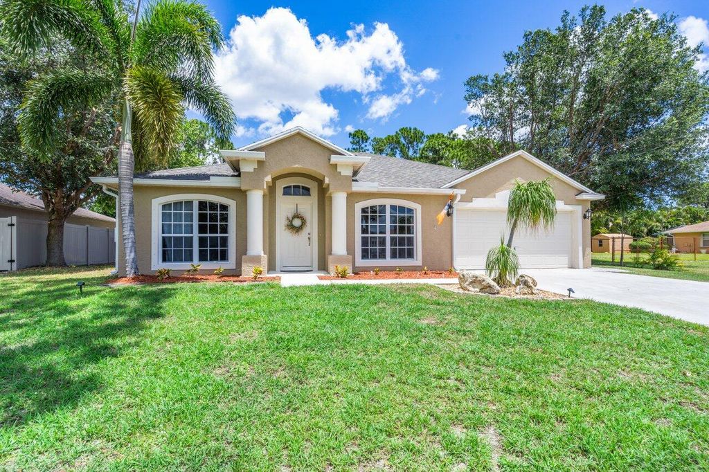 Photo of 1461 SW Delos Avenue, Port Saint Lucie, FL 34953 (MLS # R10799553)