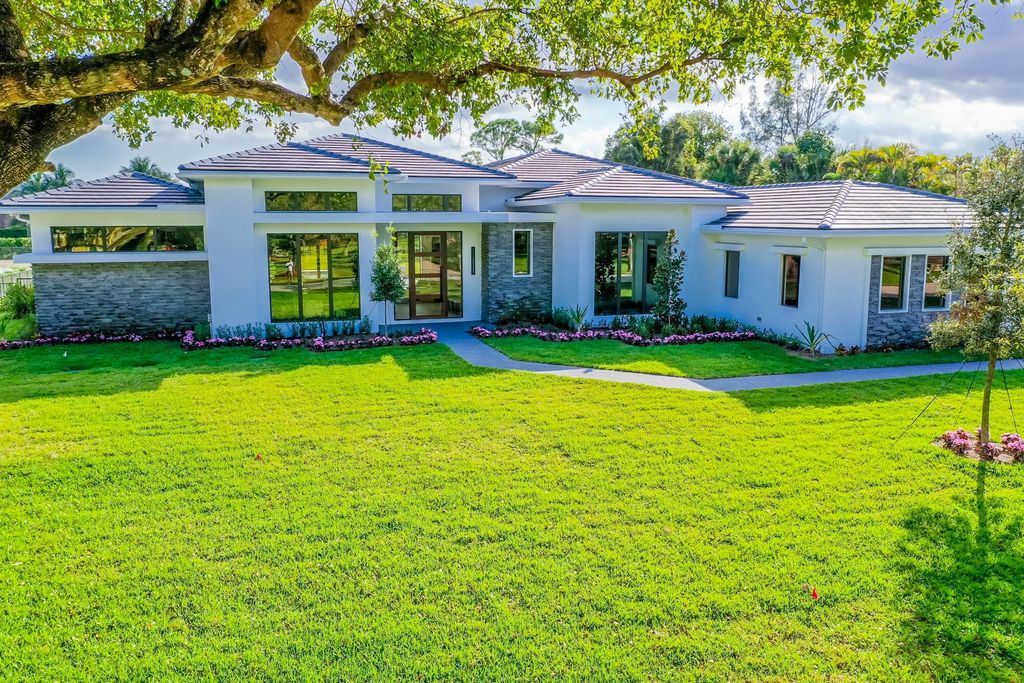 Photo of 8617 Native Dancer Road N, Palm Beach Gardens, FL 33418 (MLS # R10922837)