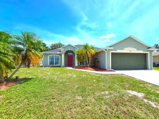 Photo of 302 NE Greenbrier Avenue, Port Saint Lucie, FL 34983 (MLS # B26059924)